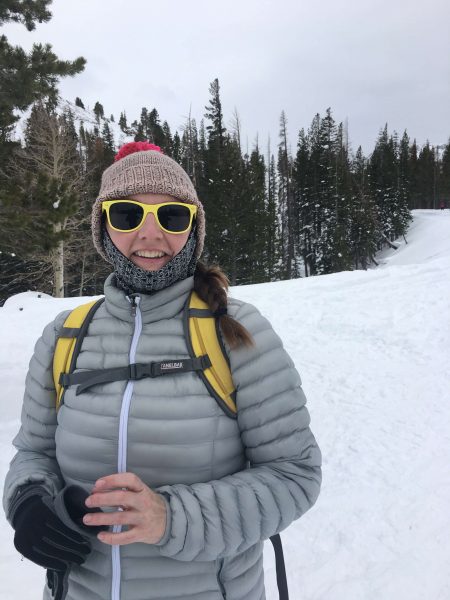 Leah Gordon, Senior Editor at Moon Travel Guides, posing in a snowy landscape