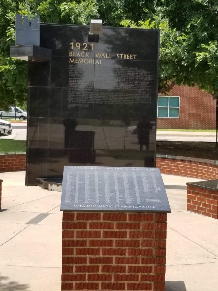 A black memorial plaque for Black Wall Street and the 1921 Tulsa Massacre