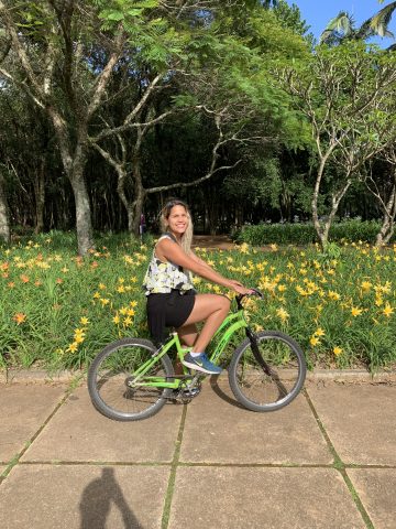 Mila Rojas on a bicycle in Ibirapuera Park in Sao Paulo