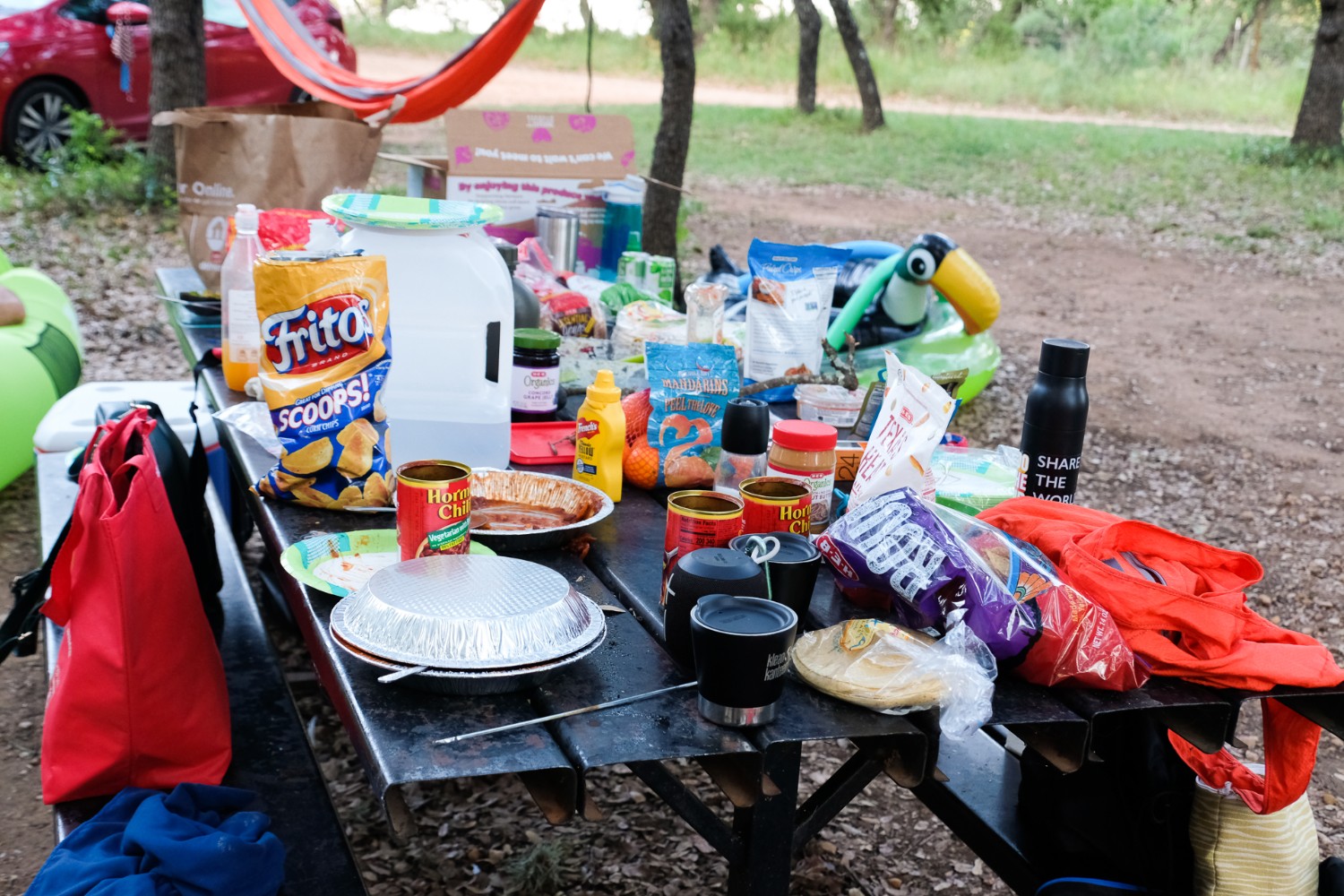 Table filled with snack foods while camping