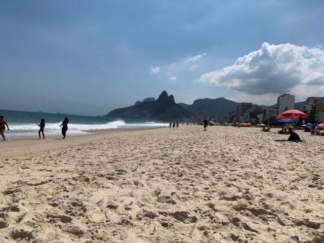 Ipanema Beach with crashing waves and a few other beach-goers