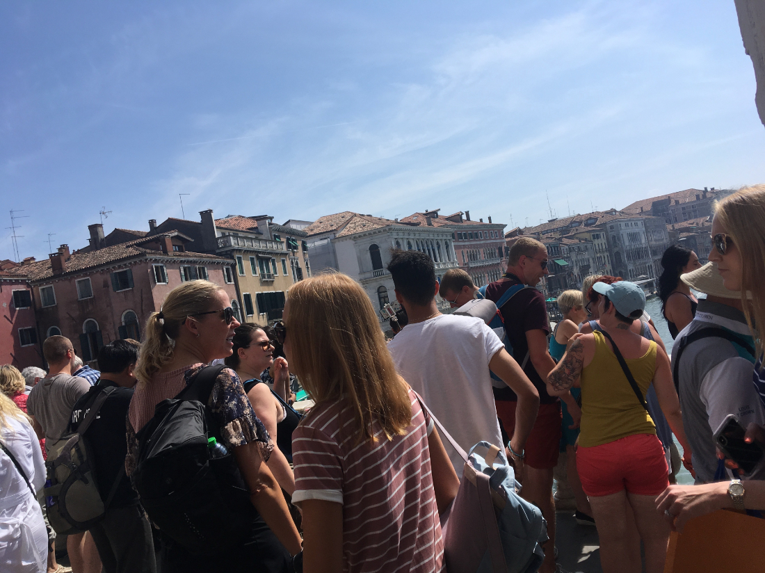 Close-up of the crowds on Rialto Bridge in Venice while traveling to Italy in the summer