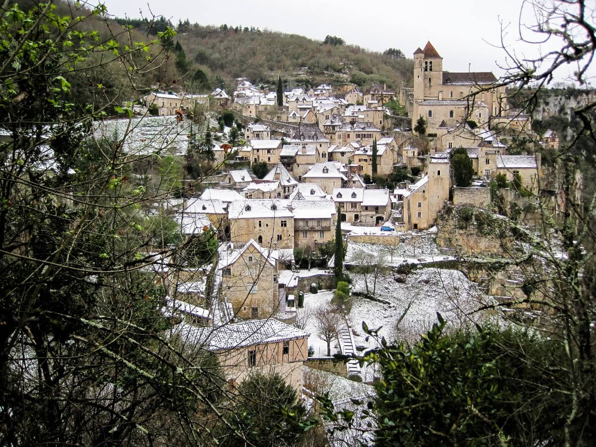 A light dusting of snow on rooftops in a French village - photo by Larissa Rolley, photography course creator at Wanderful
