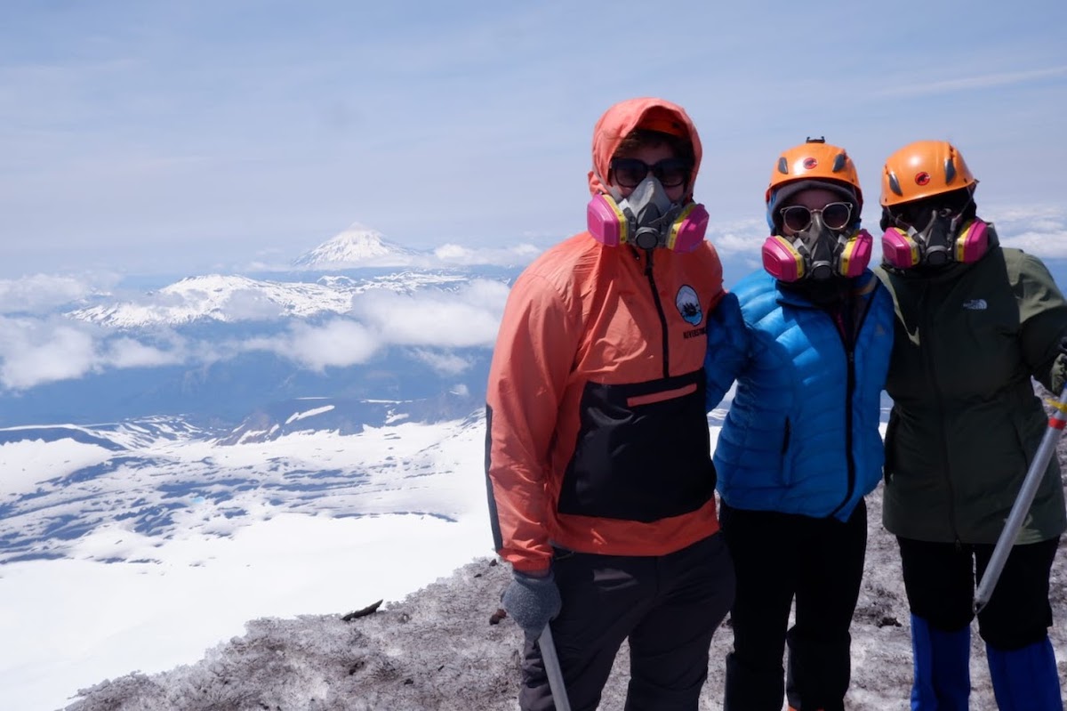 Anna Richards with two fellow hikers all donning masks while hiking Volcán Villarica in Pucón, Chile