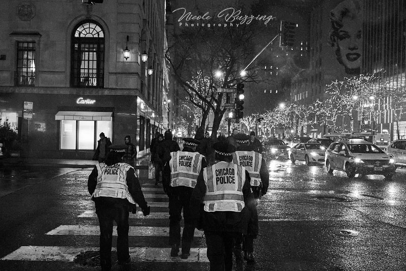 black and white image of Chicago police in the streets by Nicole Buzzing for Wanderful