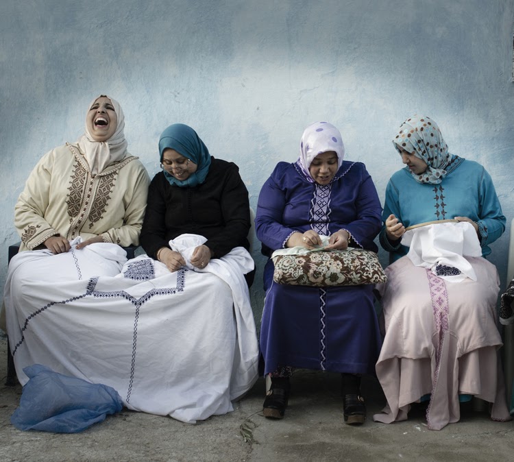 Four women sitting and laughing at the Nzala Women's Cooperative near Fes in Morocco