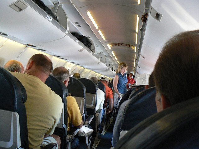 Negotiating a plane is uncomfortable for anyone. Image by Flickr user Keenan Pepper.