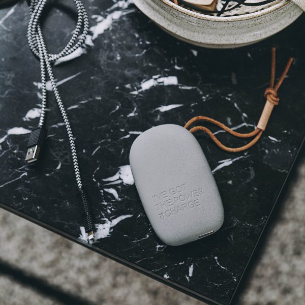 Portable charger on top of a marble effect surface.
