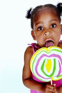 A child with a raging sweet tooth can't pass up a colorful lollipop. See more candy pictures.