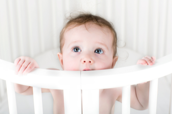 How to Help a Teething Baby Sleep | If you want to know how to help a teething baby sleep, this post has lots of tips and hacks to guide you. From knowing the early signs of teething, to which tips and products actually work, we're sharing everything you need to know. From the best teething rings and toys to relieve sore gums, to tips and products to soothe middle-of-the-night crying jags, to quick fixes to try when you're desperate, these teething hacks will give you and baby relief fast!