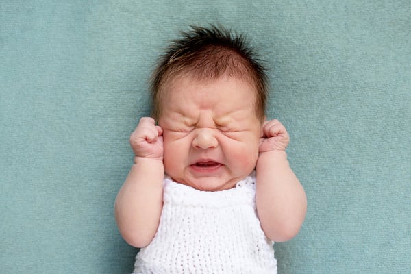9 Natural Colic Remedies | If you're a breast-feeding or bottle-feeding mama looking for tips, tricks, and remedies to help you and your newborn survive colic, this post has lots of helpful information, including the signs, symptoms, and causes of colic. From holding and swaddling, to dietary and formula changes, to movement and noise, we're sharing the best ideas to try for quick relief, allowing you and your babe to return to a place of calm asap.
