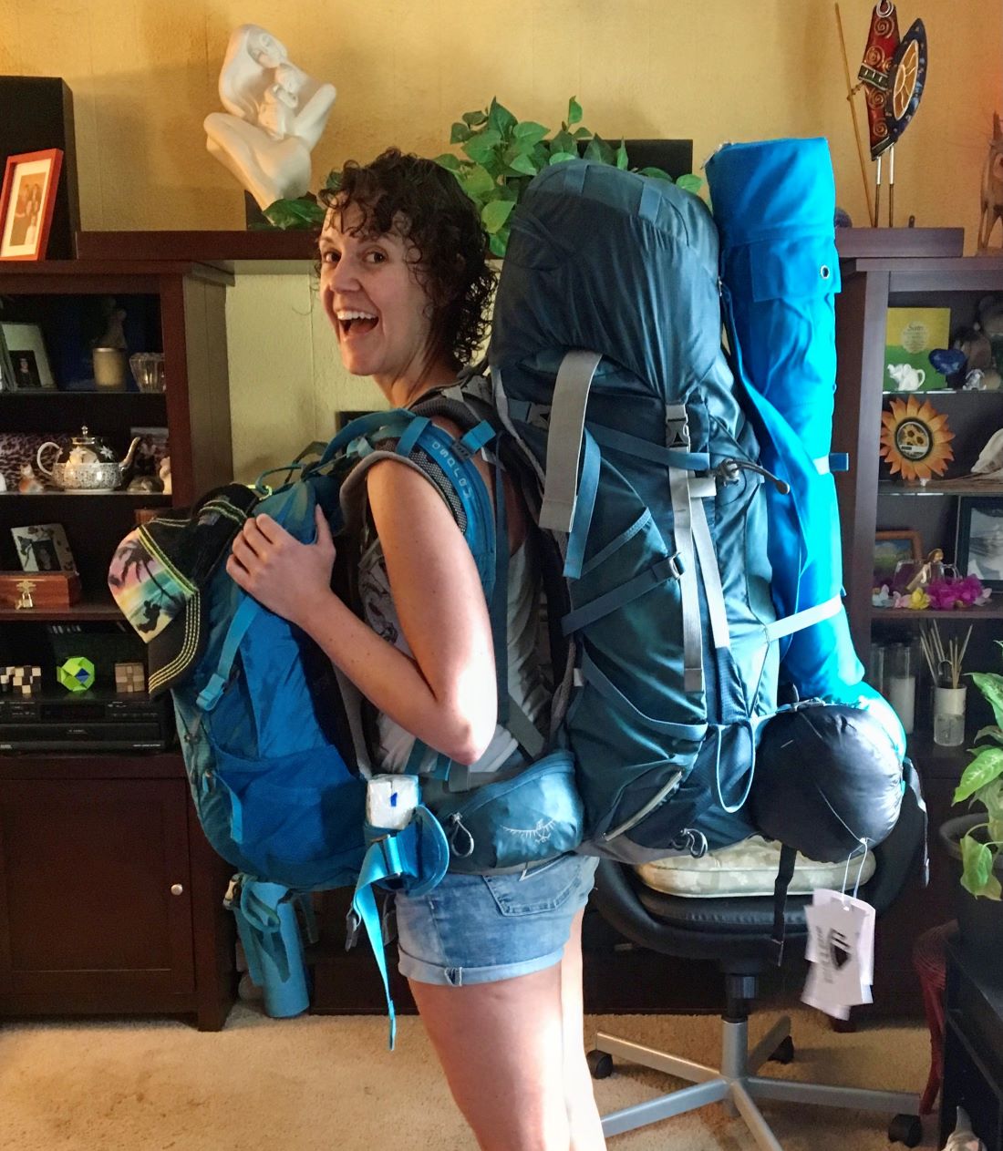 Amber Parle with two large backpacks ready for a trip